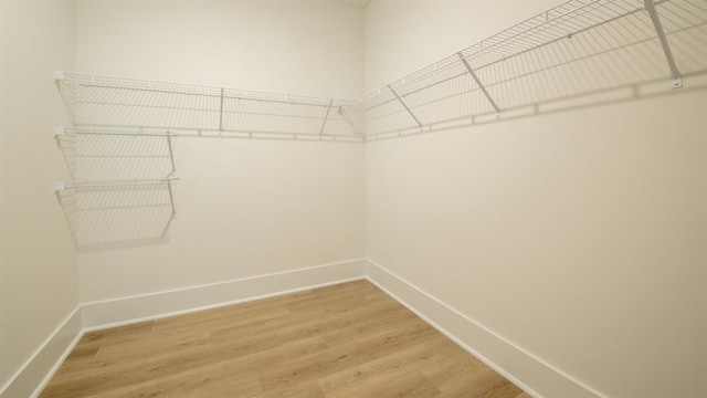 1514 Gatekeeper Ter, Marietta, GA 30066 - walk in closet featuring light wood-type flooring
