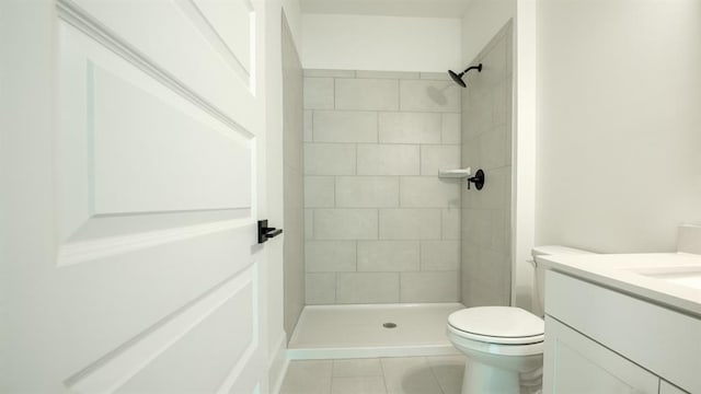 1514 Gatekeeper Ter, Marietta, GA 30066 - full bathroom with toilet, vanity, tile patterned flooring, and a tile shower
