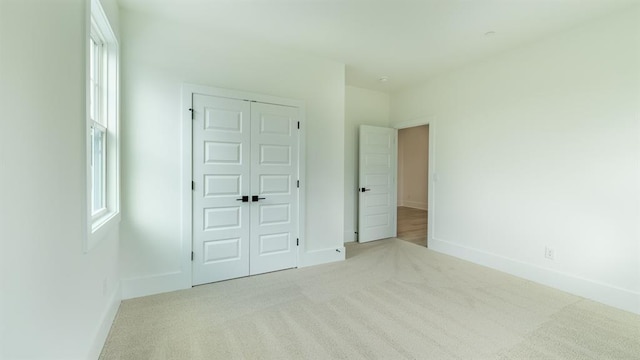 1514 Gatekeeper Ter, Marietta, GA 30066 - unfurnished bedroom with carpet, baseboards, and a closet