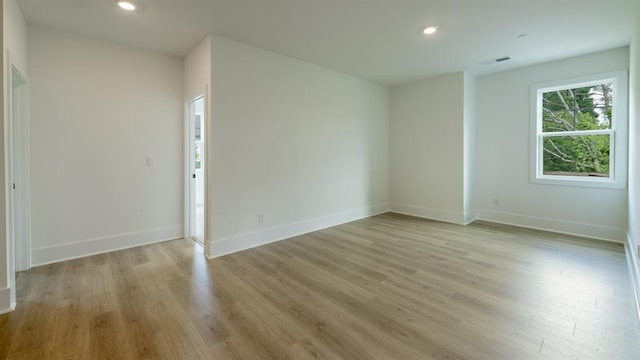 1514 Gatekeeper Ter, Marietta, GA 30066 - empty room with light wood-style flooring, recessed lighting, and baseboards