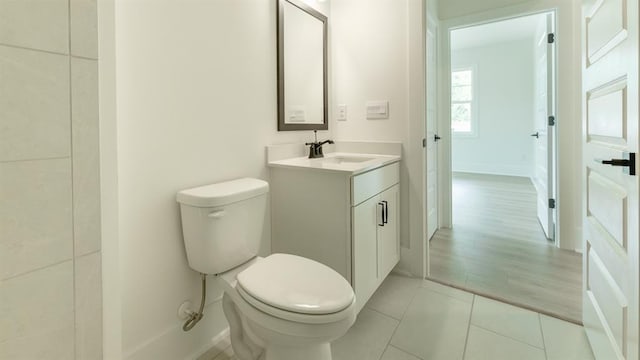 1514 Gatekeeper Ter, Marietta, GA 30066 - bathroom with toilet, vanity, tile patterned flooring, and baseboards