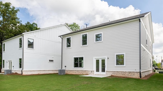 1514 Gatekeeper Ter, Marietta, GA 30066 - back of property with a yard, board and batten siding, and central AC unit