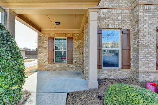 property entrance with brick siding