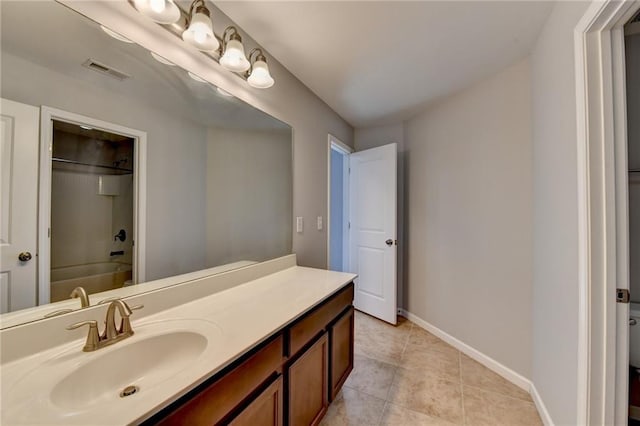 full bath with tile patterned flooring, vanity, visible vents, baseboards, and tub / shower combination