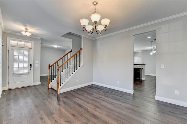 foyer with dark wood-style flooring, a notable chandelier, stairway, ornamental molding, and baseboards