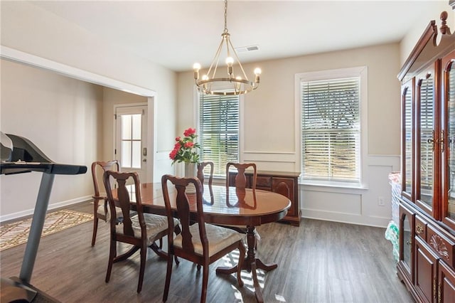 121 Jim Daws, Monroe, GA 30655 - dining area with dark hardwood / wood-style flooring, a wealth of natural light, and a notable chandelier