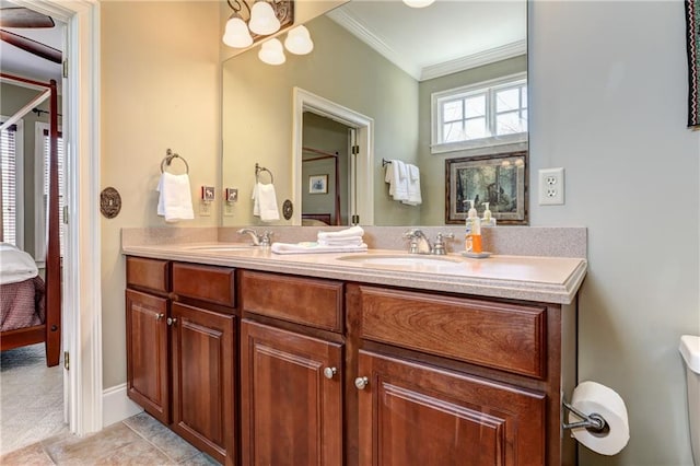 bathroom featuring vanity, ornamental molding, and tile patterned floors