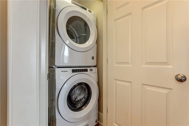 laundry area with stacked washer and clothes dryer