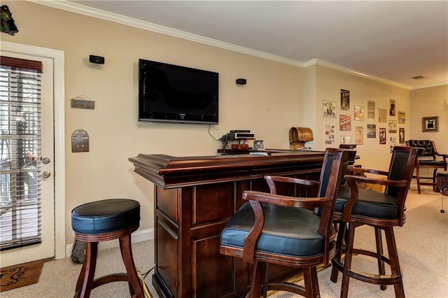 bar featuring crown molding, dark brown cabinetry, and light colored carpet