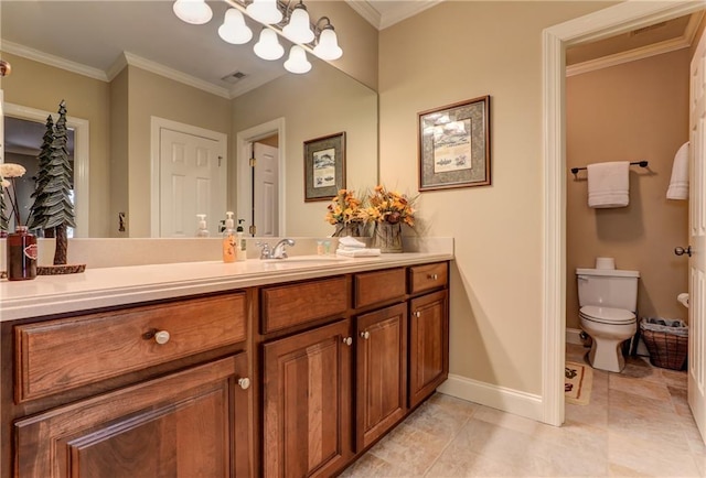 bathroom with vanity, toilet, crown molding, and tile patterned floors