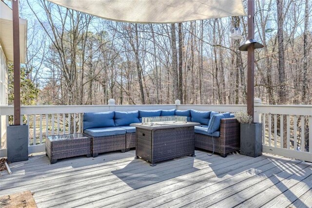 wooden deck with an outdoor living space