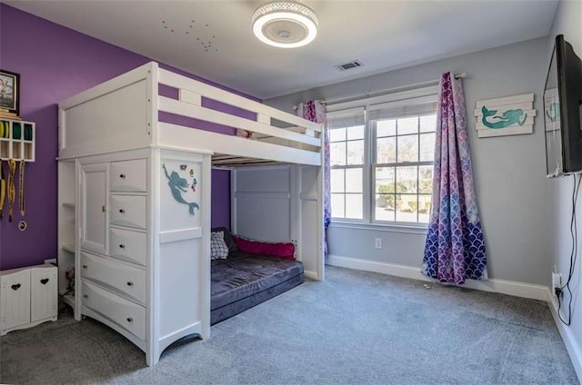 unfurnished bedroom featuring carpet floors, visible vents, and baseboards