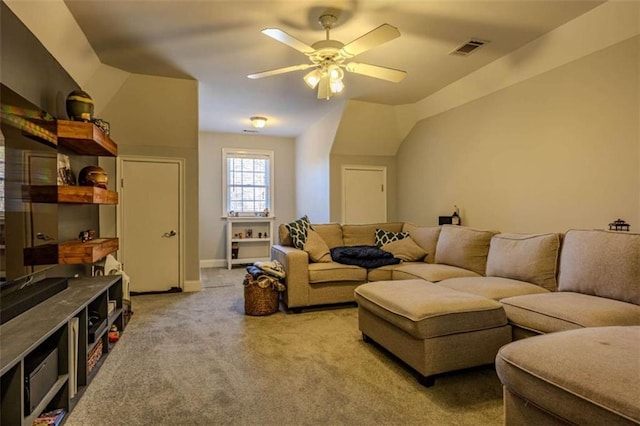 carpeted living room with ceiling fan, visible vents, vaulted ceiling, and baseboards