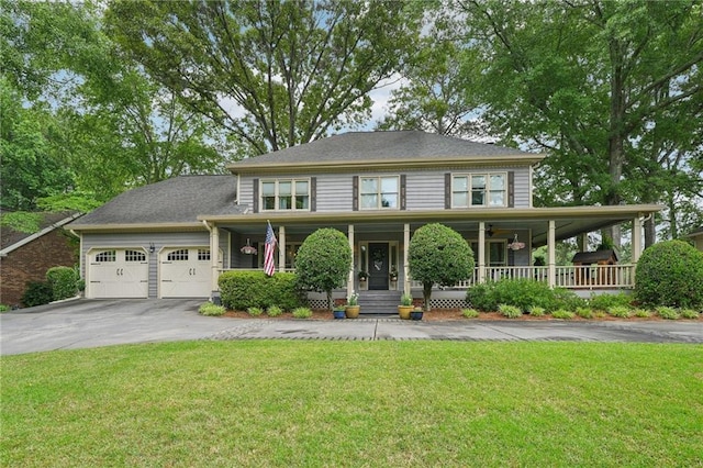 177 Coopers Pond Dr, Lawrenceville, GA 30044 - view of front of property featuring driveway, a garage, a porch, and a front lawn