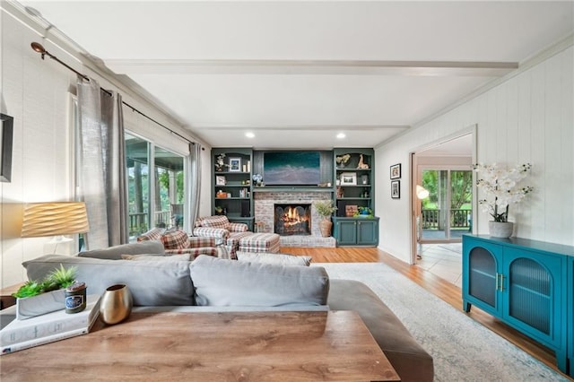 177 Coopers Pond Dr, Lawrenceville, GA 30044 - living area with light wood-style floors, plenty of natural light, beam ceiling, and a fireplace