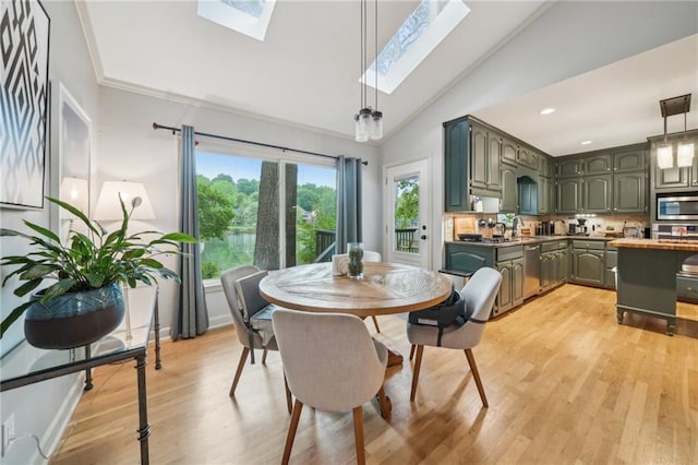 177 Coopers Pond Dr, Lawrenceville, GA 30044 - dining room featuring a skylight, light wood finished floors, recessed lighting, baseboards, and high vaulted ceiling
