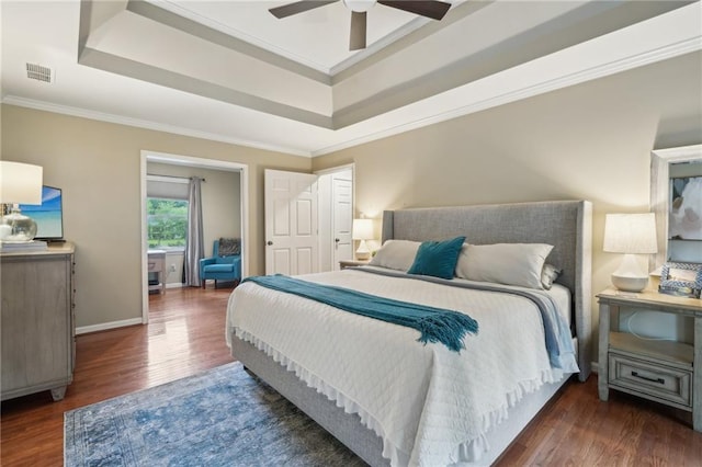 177 Coopers Pond Dr, Lawrenceville, GA 30044 - bedroom featuring a raised ceiling, wood finished floors, crown molding, baseboards, and ceiling fan