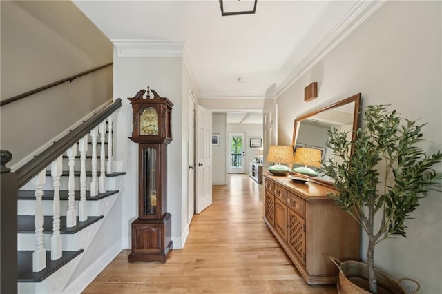 177 Coopers Pond Dr, Lawrenceville, GA 30044 - hallway featuring light wood finished floors, stairway, crown molding, and baseboards
