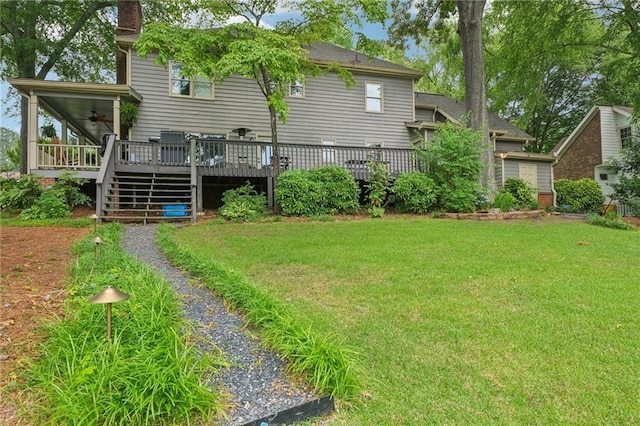 177 Coopers Pond Dr, Lawrenceville, GA 30044 - rear view of property featuring a yard, a deck, a ceiling fan, a chimney, and stairs