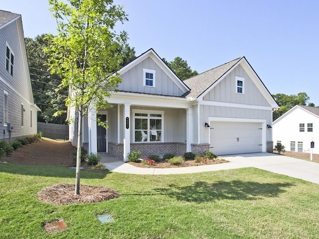view of front facade featuring brick siding, board and batten siding, driveway, and a front yard