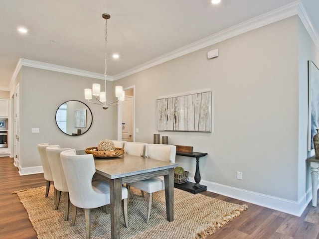 dining space featuring baseboards, ornamental molding, dark wood-style floors, and an inviting chandelier