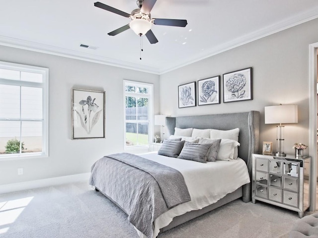 bedroom with crown molding, baseboards, carpet, and visible vents