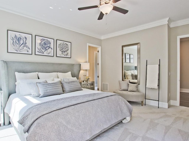 bedroom featuring visible vents, a ceiling fan, baseboards, and crown molding