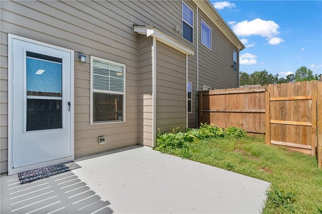 view of patio featuring fence