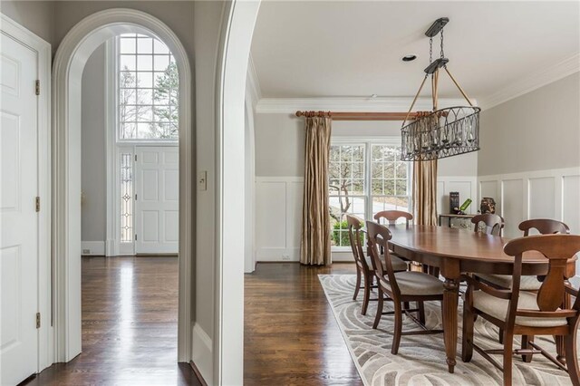 carpeted bedroom with visible vents, ornamental molding, and access to outside