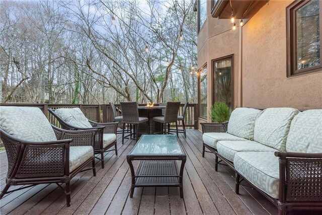 deck featuring an outdoor fire pit