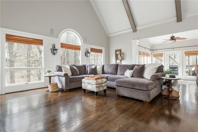 living room with stairway, ornamental molding, visible vents, and a tiled fireplace