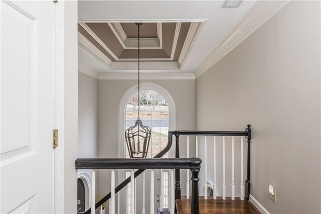 living room featuring carpet floors, ornamental molding, baseboards, and a tile fireplace