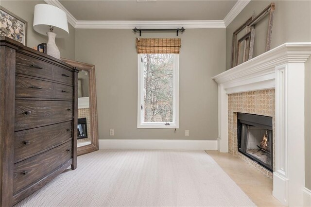 bedroom with visible vents, crown molding, baseboards, light carpet, and a tray ceiling