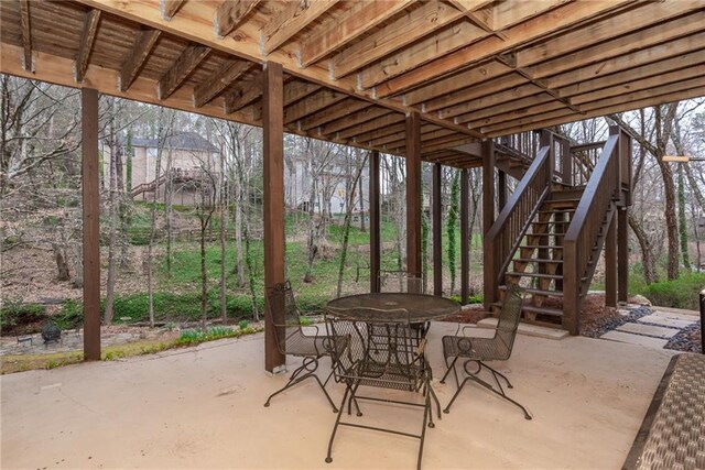 view of yard with stairs and a wooden deck