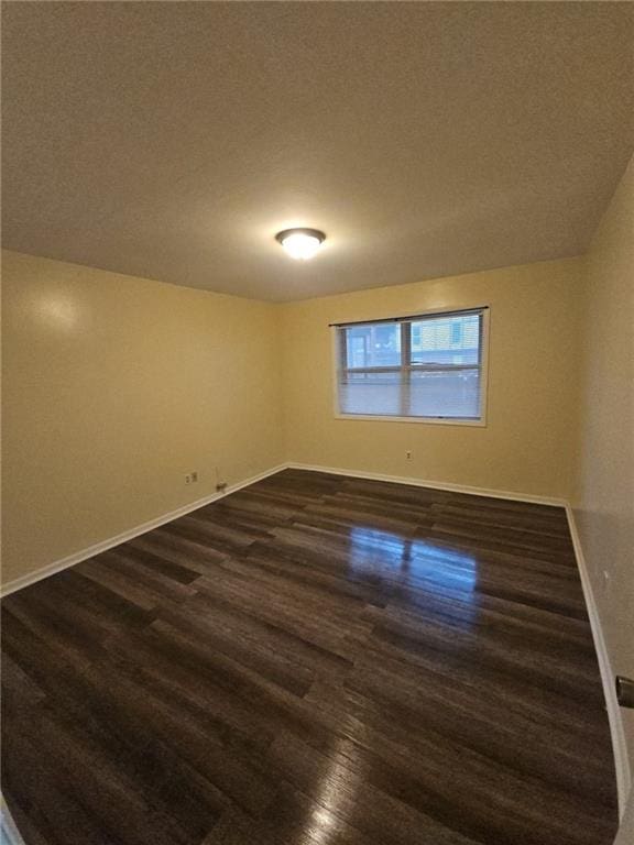 6851 Roswell Rd Unit 15, Atlanta, GA 30328 - empty room featuring dark wood-style flooring and a textured ceiling