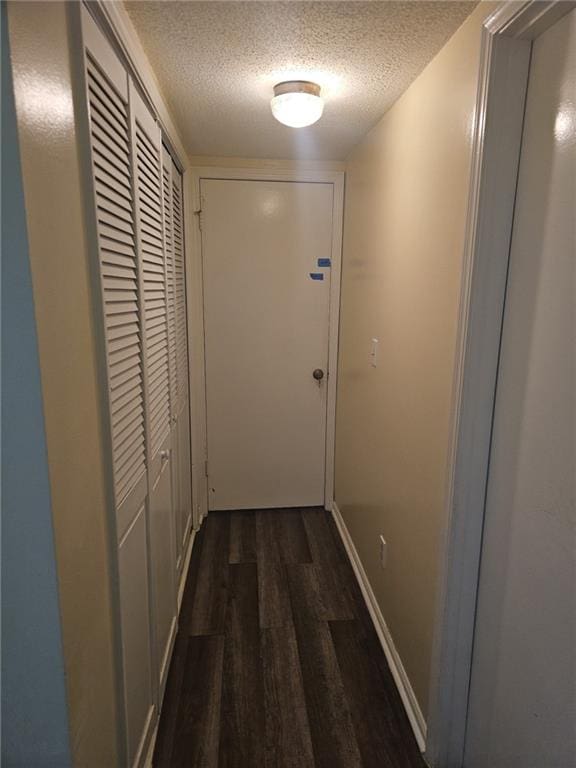 6851 Roswell Rd Unit 15, Atlanta, GA 30328 - corridor featuring a textured ceiling and wood finished floors