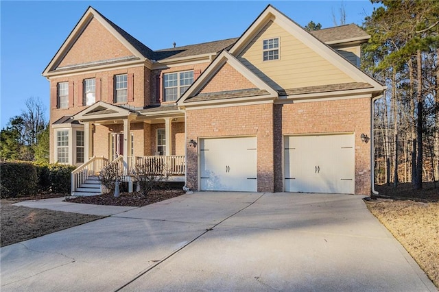 view of front of home featuring covered porch and a garage