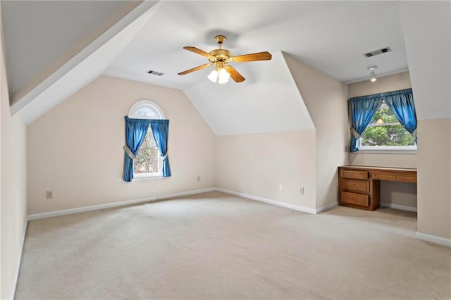 bonus room featuring visible vents, lofted ceiling, and carpet