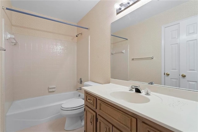 bathroom with tile patterned floors, vanity, toilet, and shower / tub combination