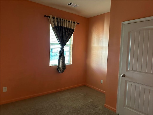 unfurnished room featuring carpet flooring