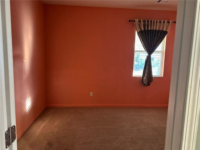 unfurnished room with carpet flooring