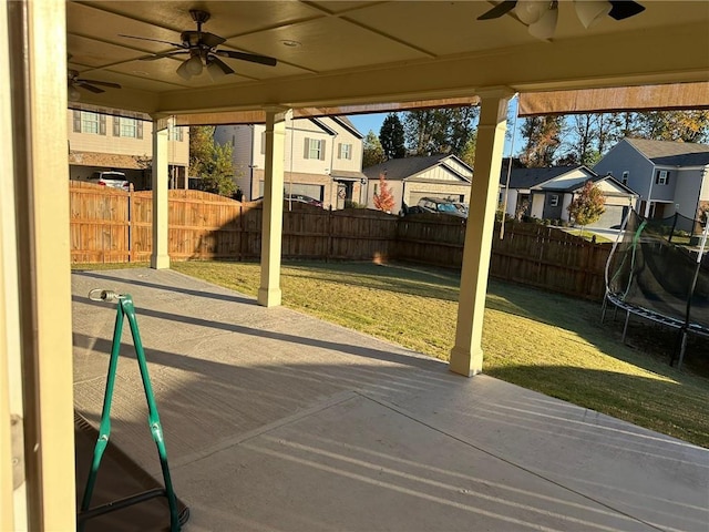 view of patio / terrace featuring ceiling fan and a trampoline