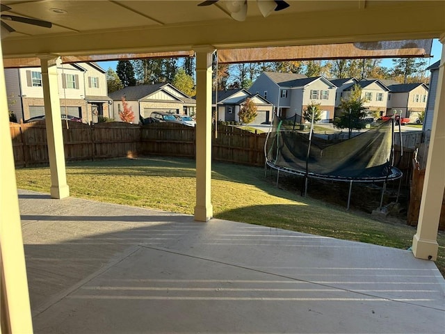 view of patio featuring a trampoline and ceiling fan