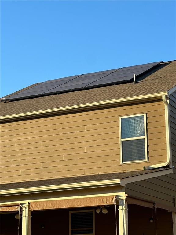 view of home's exterior featuring solar panels