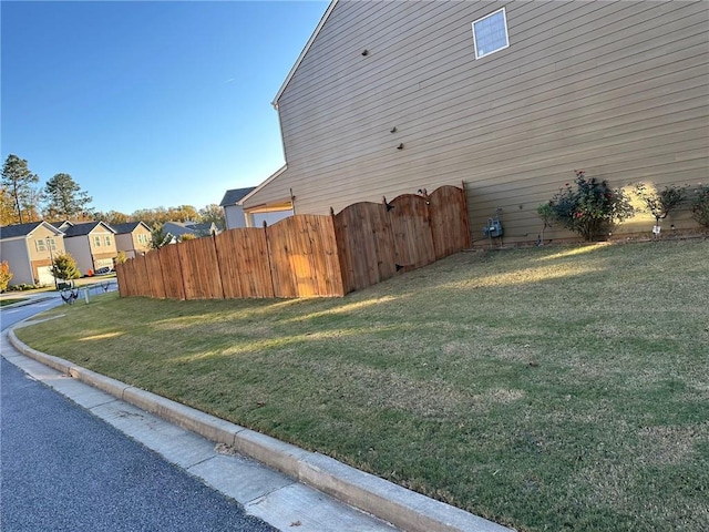 view of property exterior with a lawn