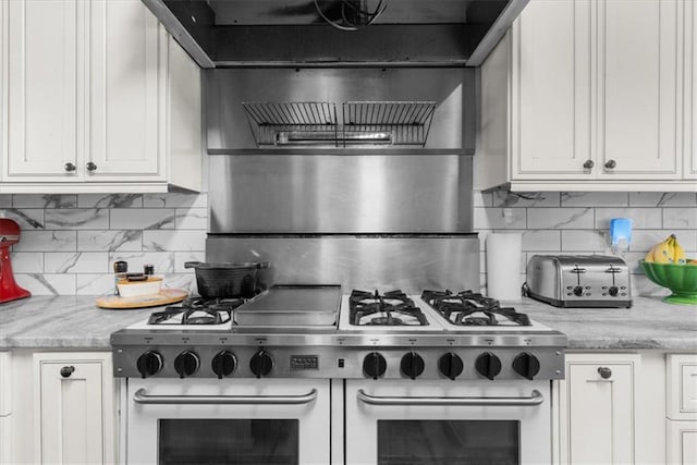 9035 Walnut Cove Ct, Gainesville, GA 30506 - kitchen with tasteful backsplash, double oven range, and white cabinetry