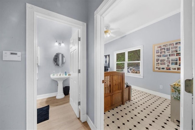 9035 Walnut Cove Ct, Gainesville, GA 30506 - bathroom featuring baseboards, a ceiling fan, crown molding, and a sink