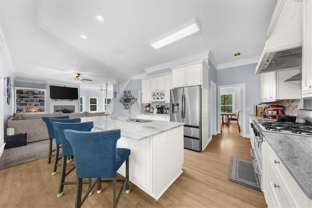 9035 Walnut Cove Ct, Gainesville, GA 30506 - kitchen with stainless steel appliances, a sink, ornamental molding, ceiling fan, and healthy amount of natural light