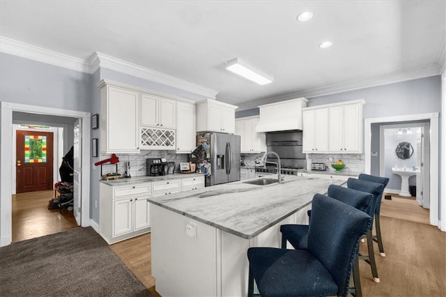 9035 Walnut Cove Ct, Gainesville, GA 30506 - kitchen featuring stainless steel refrigerator with ice dispenser, custom exhaust hood, a sink, crown molding, and backsplash