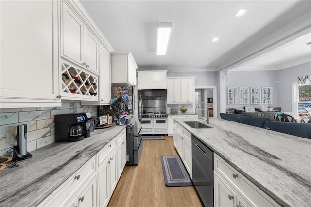 9035 Walnut Cove Ct, Gainesville, GA 30506 - kitchen with a sink, appliances with stainless steel finishes, white cabinetry, backsplash, and light wood finished floors